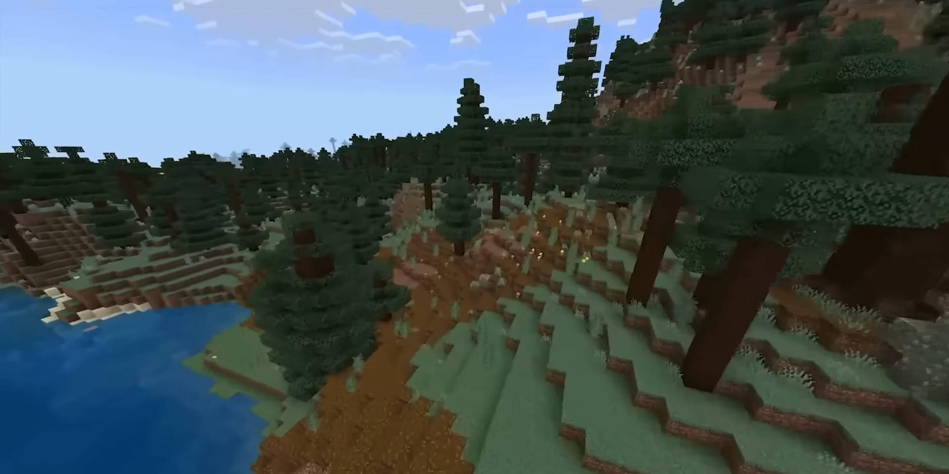 Настоящий игровой кадр Minecraft: хвойный лес и река у подножия холмов